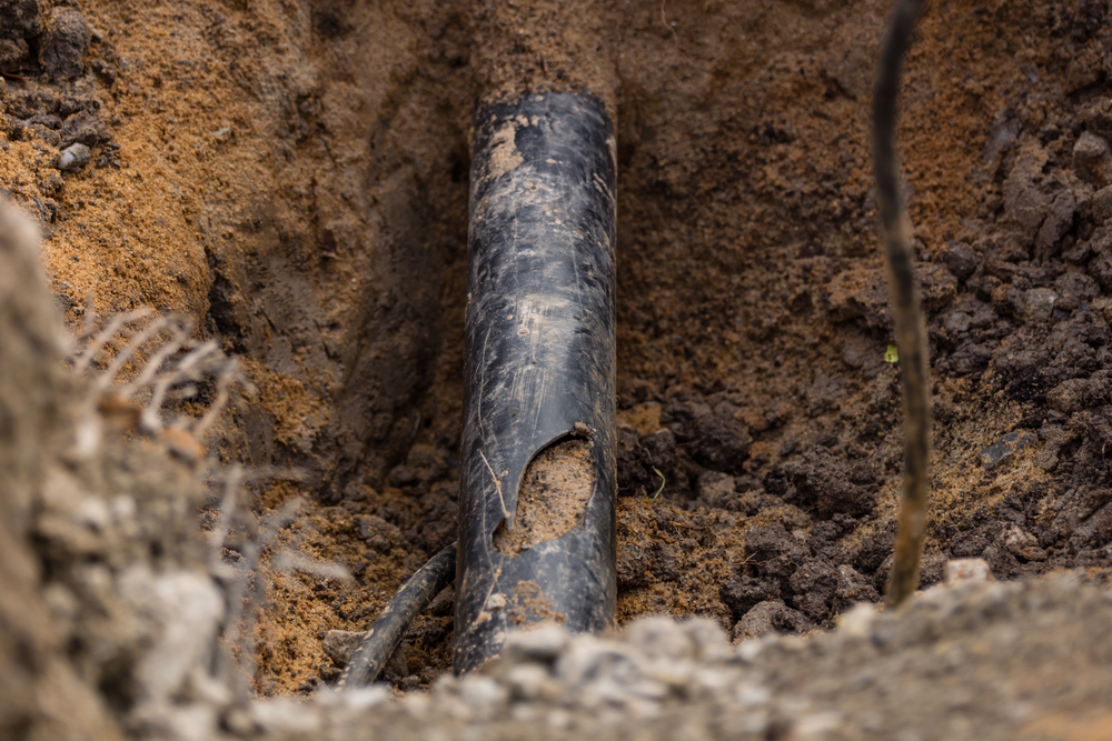 Damaged,Pipe,Excavated,In,The,Soil